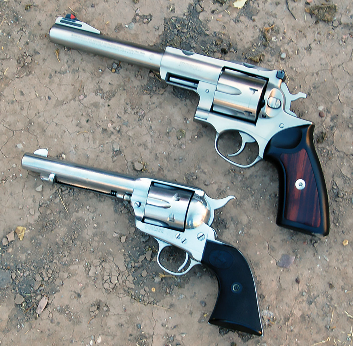 The Ruger Super Redhawk (top) is a big revolver compared to the 45 Colt SAA (bottom).